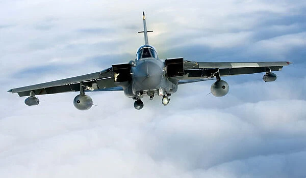A Tornado GR4 from 125 Squadron based at RAF Lossiemouth soars high above the clouds