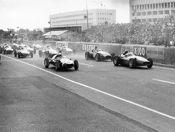 1958 Caen Grand Prix: Stirling Moss, 1st position, leads Jean Behra, retired, at the start, action
