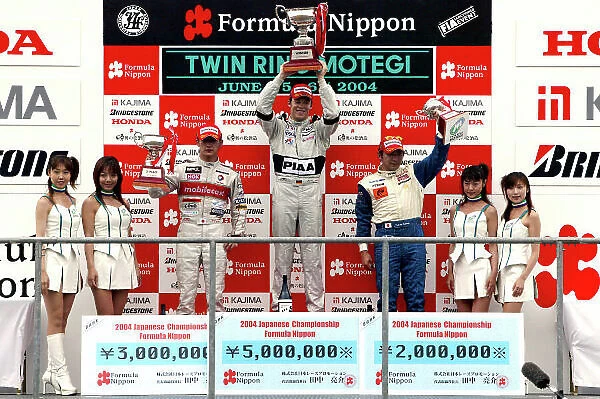 2004 Formula Nippon Championship Motegi, Japan. 6th June 2004. Race winner, Andre Lotterer (PIAA Nakajima) 1st, Yufi Ide (Mobilecast IMPUL) 2nd and Tatsuya Kataoka (LeMans Spirit) 3rd. Podium