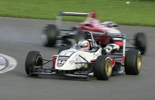 2006 British Formula Three Championship. Silverstone, England 23rd - 24th September. Race 2. Christian Bakkerud, (Carlin Motorsport) leads Stuart Hall, (Fortec Motorsport)