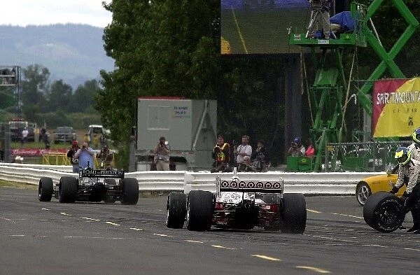 Bruno Junqeira (BRA) could never quite get around Cristiano da Matta (BRA) and ended up second in the race by less than one second Portland International Raceway, Portland, Oregon, USA 16 June, 2002 DIGITAL