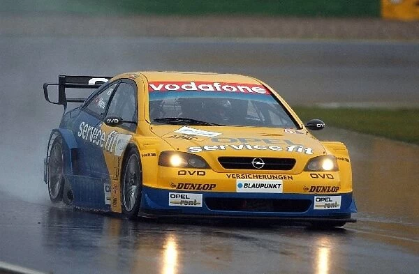 DTM Championship: Alain Menu, Opel Astra Coupe, started the sunday promising by being fastest during the extreme wet warm up session