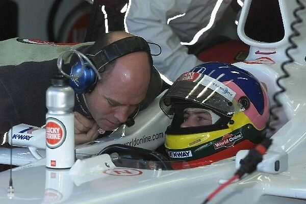 F1 Testing: Jacques Villeneuve talks with his engineer during his first run in the new BAR