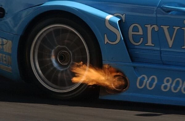 Fire from the exhaust from the car of Gary Paffett (GBR), Service 24h AMG Mercedes-Benz CLK-DTM