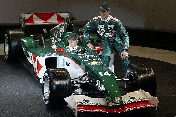 Formula One Launch: R-L: Mark Webber and Christian Klien, in car, with the new Jaguar Cosworth R5