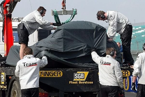 Formula One Testing: The car of Alex Wurz McLaren Mercedes MP4  /  18 is returned to the pits