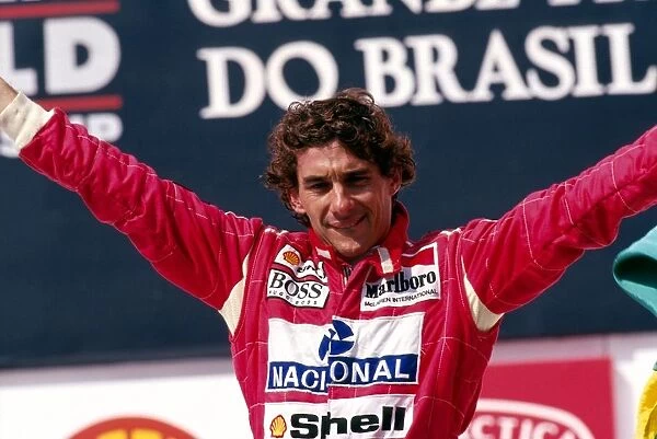 Formula One World Championship: Ayrton Senna McLaren celebrates his second and final home GP victory on the podium