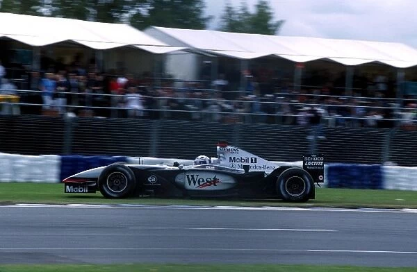 Formula One World Championship: David Coulthard McLaren Mercedes MP4-17 lead the race until gearbox problems caused him to overshoot the corners