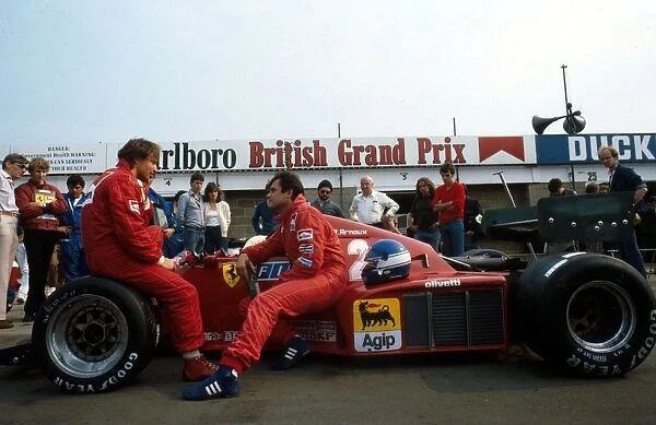 Formula One World Championship: The Ferrari team mates Rene Arnoux, left and Patrick Tambay chat