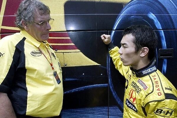 Formula One World Championship: Gary Anderson Jordan designer talks with Takuma Sato Jordan