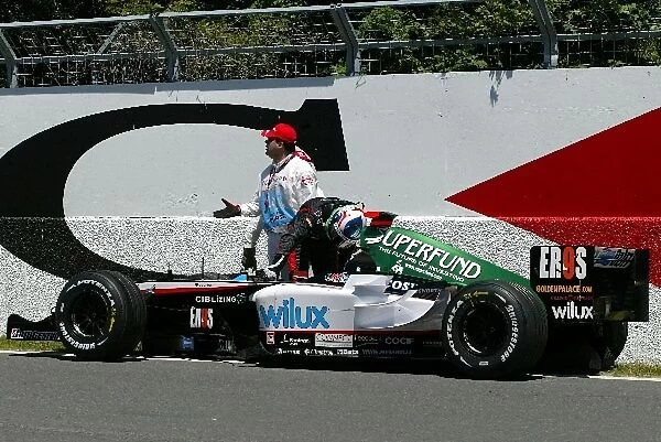 Formula One World Championship: Gianmaria Bruni Minardi Cosworth PS04B stops on circuit during his first pre-qualifying run