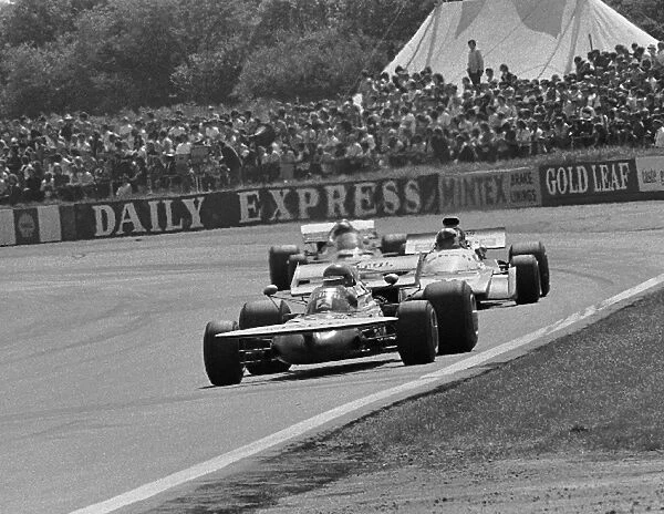Formula One World Championship: Henri Pescarolo March 711, finished in 4th place here leading Chris Amon Matra MS120B