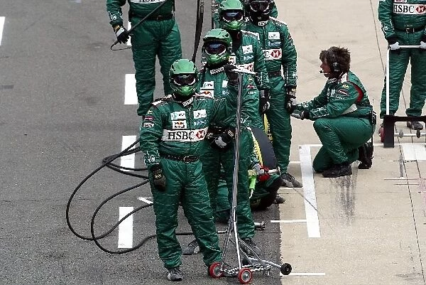 Formula One World Championship: The Jaguar team await a pitstop