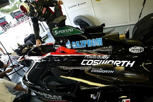 Formula One World Championship: Jos Verstappen gets into a Minardi Cosworth PS03 in the garage