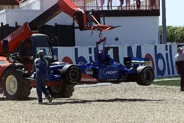 Formula One World Championship: Luciano Burti Prost Acer AP04 is craned to safety