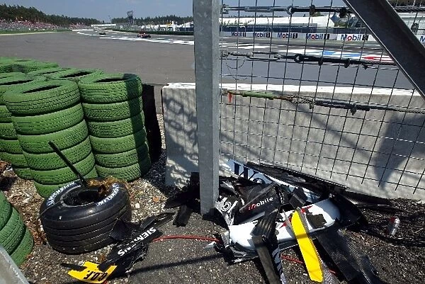 Formula One World Championship: Mostly McLaren debris from the MP4  /  17D of Kimi Raikkonen after the first corner crash