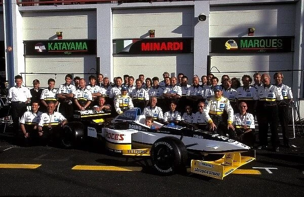 Formula One World Championship: The Minardi Team pose for their group photo with the Minardi M197