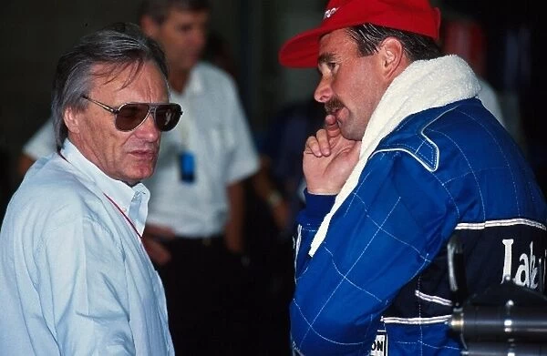 Formula One World Championship: Nigel Mansell, right, talks with Bernie Ecclestone