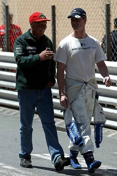 Formula One World Championship: Niki Lauda walks in with Ralf Schumacher