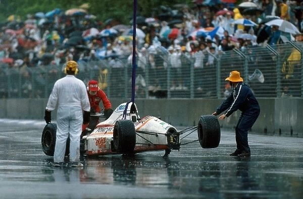 Formula One World Championship: Piercarlo Ghinzanis Osella FA1-M89 is removed after a shunt with Nelson Piquet