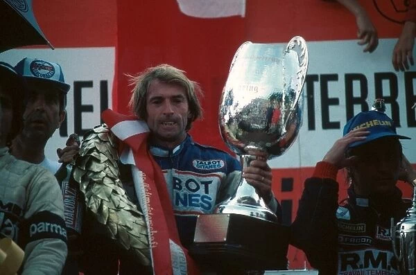 Formula One World Championship: Race winner Jacques Lafitte Ligier, celebrates on the podium