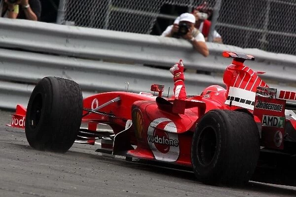 Formula One World Championship: Second place Michael Schumacher Ferrari F2005 waves to the crowd