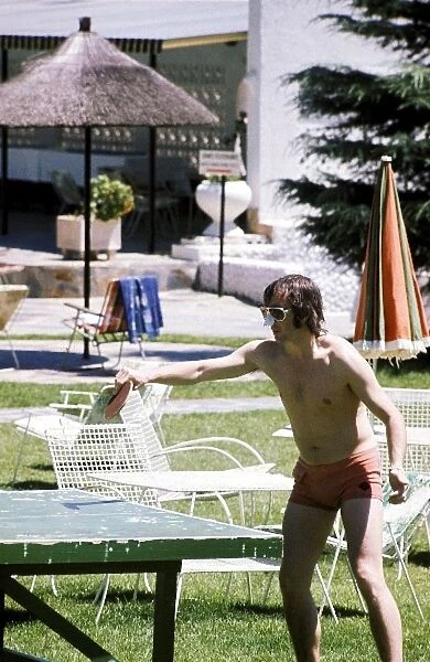 Formula One World Championship: Second placed Jackie Stewart enjoys a game of table tennis at the Kyalami Ranch Hotel