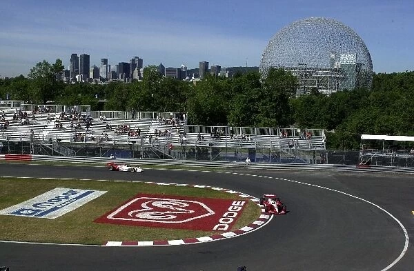 Kenny Brack and Tora Takagi negotiate the hairpin of the Circuit Gilles Villeneuve during practice for the Molson Indy Montreal. Circuit Gilles Villeneuve, Montreal, Quebec, Can. 23