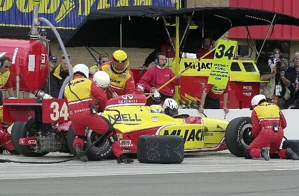 Laurent Redon, (FRA), Dallara  /  Infiniti, makes an early pit stop on his way to a career best third place finish in the