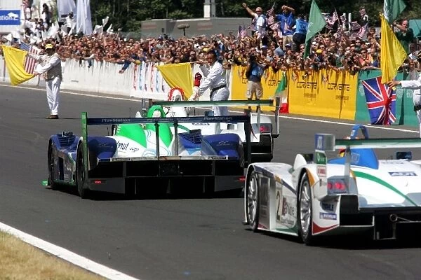 Le Mans 24 Hours: Tom Kristensen Champion Racing Audi R8 crosses the line to score a record seventh Le Mans 24 Hours win