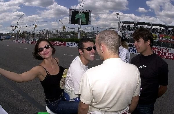Mr. and Mrs. Franchitti have a laugh with Cristiano da Matta and Oriol Servia prior to qualifying for the Molson Indy Toronto. Exhibition Place, Toronto, Ont. Ca. 07