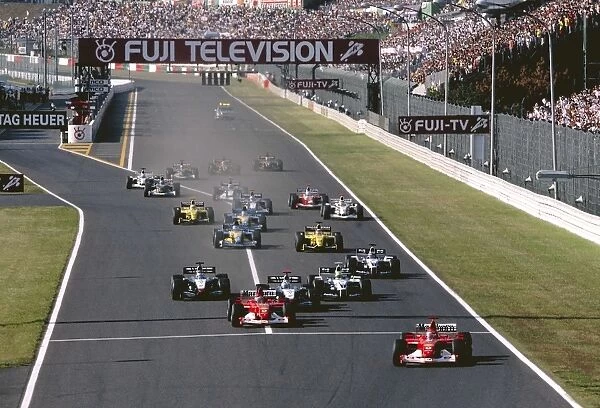 Suzuka, Japan. 11th - 13th October 2002: Race winner Michael Schumacher, Ferrari F2002, leads team mate Rubens Barrichello, at the start of the race
