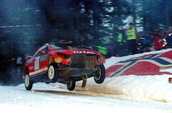 World Rally Championship: Marcus Gronholm with co-driver Timo Rautiainen Peugeot 307 WRC having sustained damage on stage 12