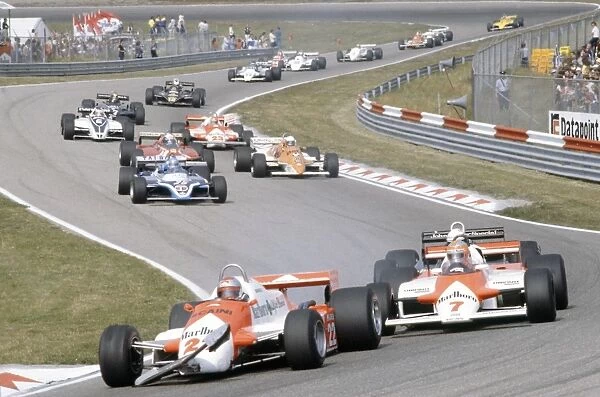 Zandvoort, Holland. 28-30 August 1981: Mario Andretti leads John Watson, Elio de Angelis, Patrick Tambay, Riccardo Patrese, Didier Pironi, Bruno Giacomelli