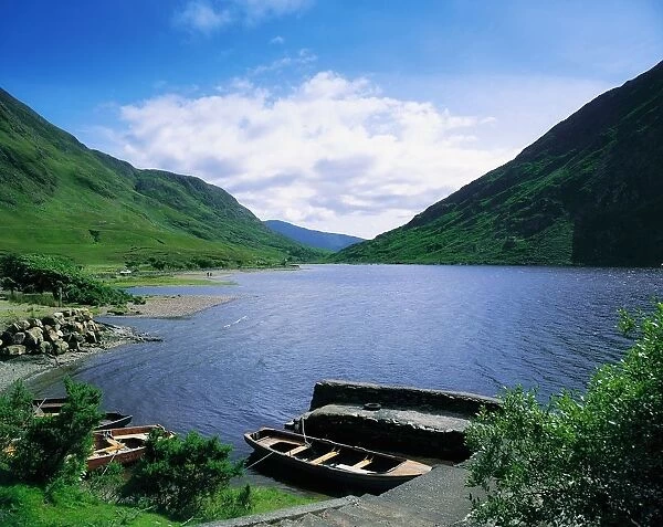 Doo Lough, Delphi, Co Mayo, Ireland; Boats On The Edge Of A Lake