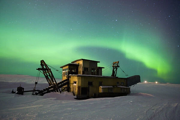 Green Northern Lights Dance Over A Historical Gold Dredge Near Nome, Alaska