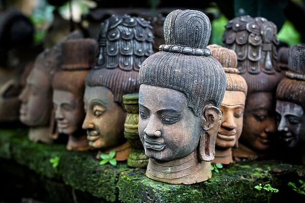 Heads Of Statues Of Buddha Are Stacked In A Terra-Cotta Factory; Chiang Mai, Thailand
