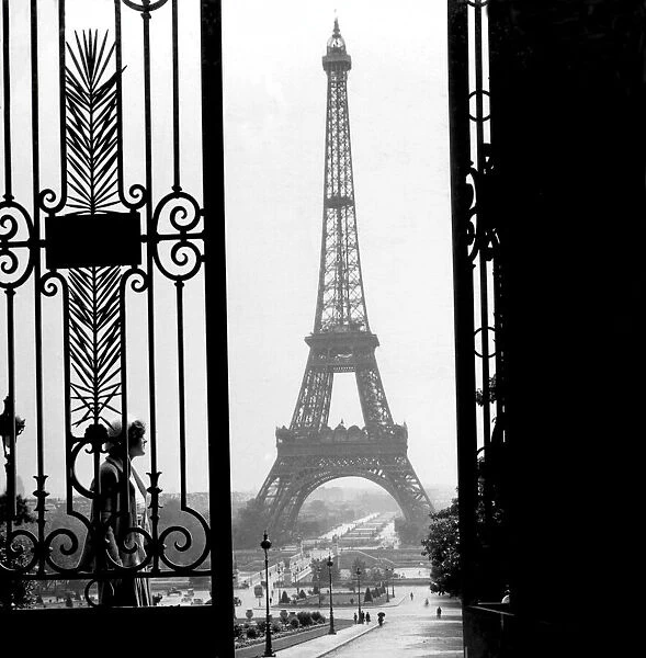 Historic image in black and white of the Eiffel Tower in Paris, France circa 1920; Paris, France
