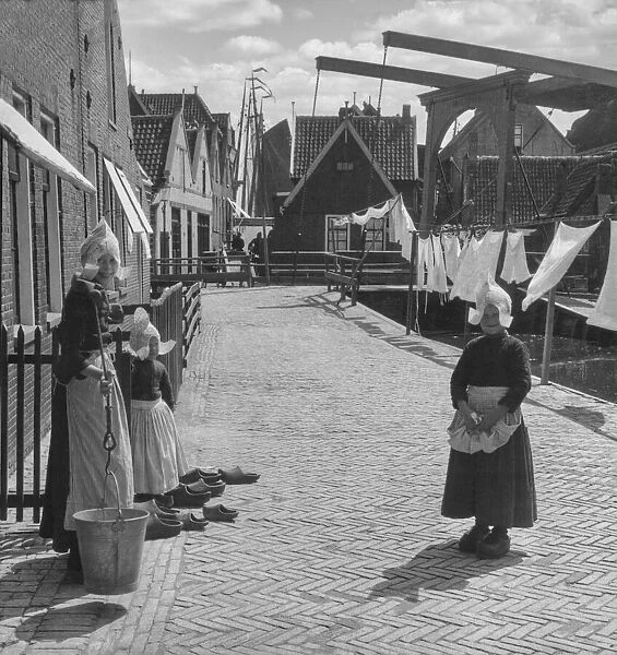 Historic image of girls dressed in traditional dutch clothing, circa 1920; Holland