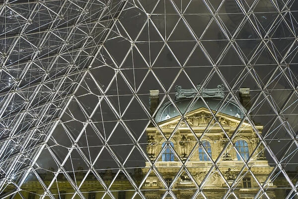 Looking Out Of The Pyramid To The Louvre Museum At Night, Paris, France