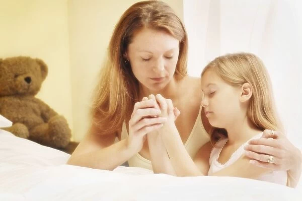 Mother Praying With Daughter