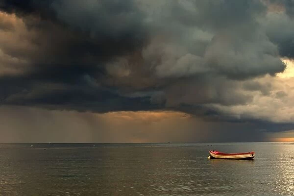 North Sea, Sunderland, Tyne And Wear, England; Dark Clouds And Lone Boat