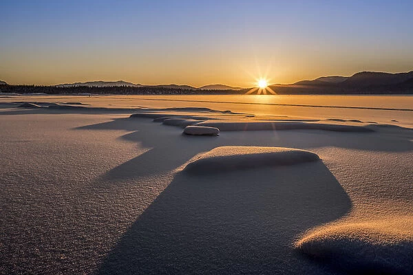 Sunset over Mendenhall Lake in winter, Alaska, USA