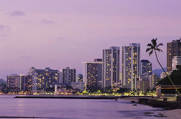 USA, Hawaii, Oahu, Honolulu, Hotels on Waikiki beach at dusk; Waikiki