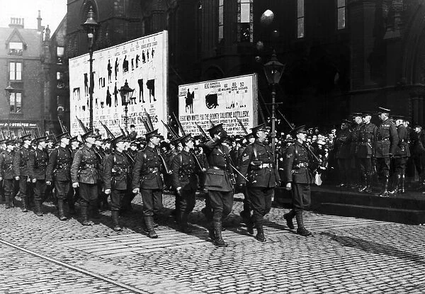 The 16th Manchesters march past Lord Kitchener at Manchester Town Hall with the rest of