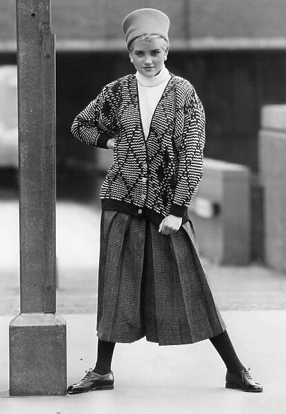 1980s Womens Fashion: Our model wears. Diamond pattern cardigan over a white turtle