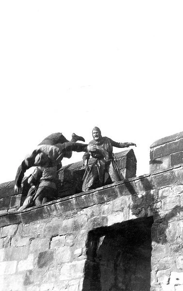 Actors and stunt men fighting on the wall of Alnwick Castle in 1981