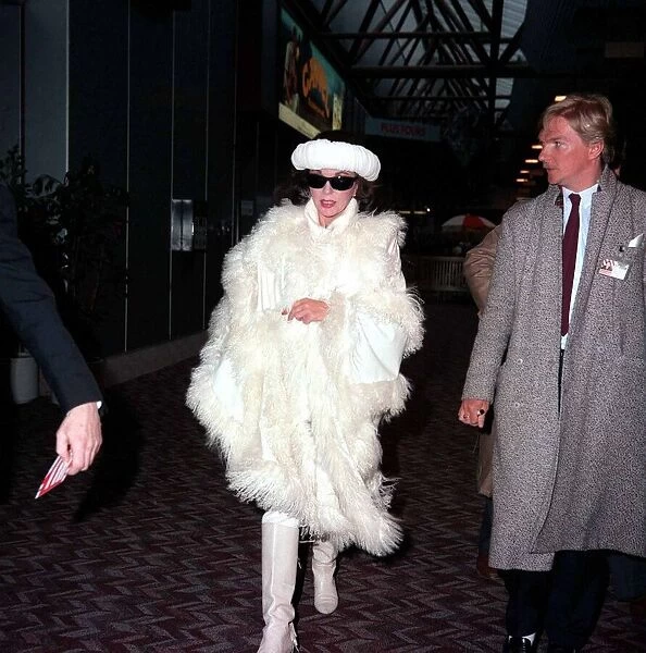 Actress Joan Collins arriving at Lodon Airport February 1987