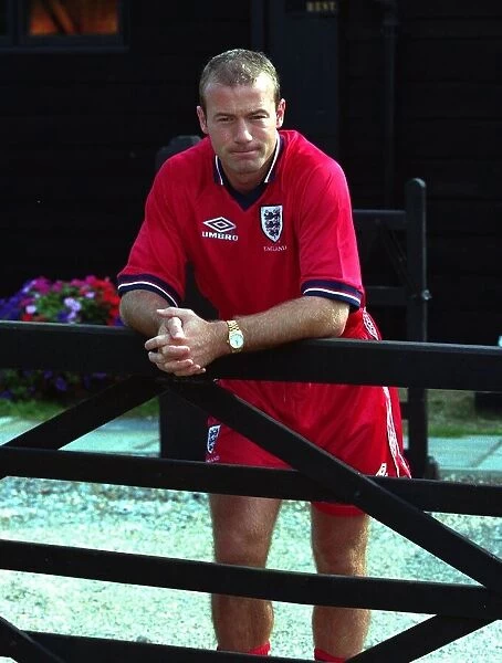 Alan Shearer August 1998 England Football Player standing leaning against fence