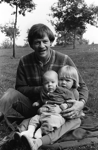Alex Higgins former World Snooker Champion 1983 with his two children at home